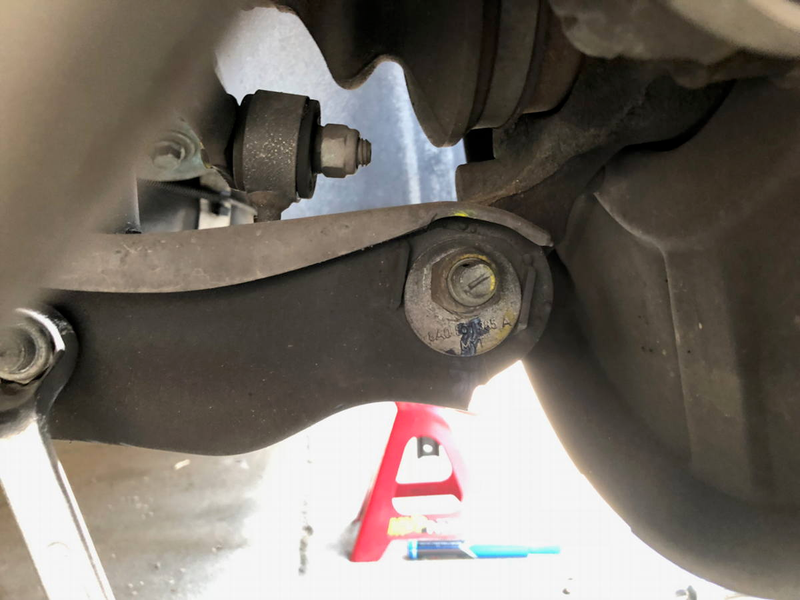 There are far more bolts that you have to loosen than remove to extract the rear struts. It’s vitally important to mark the position of the lower arm locator to ensure proper camber upon reassembly.